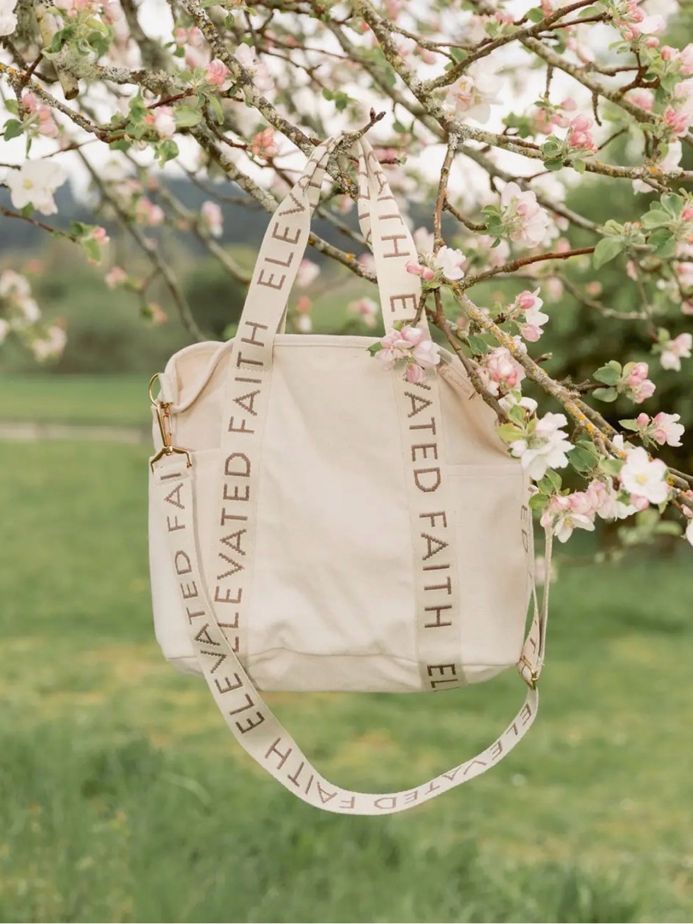 Elevated Faith Cream Canvas Tote with Logo Strap. AVAILABLE FOR PRESALE.